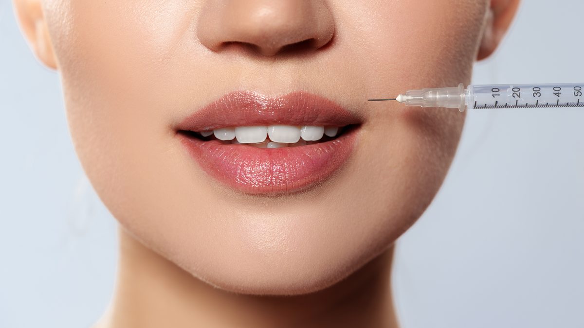 Patient preparing for lip filler treatment at Cosmo Clinic Lisbon — expat guide
