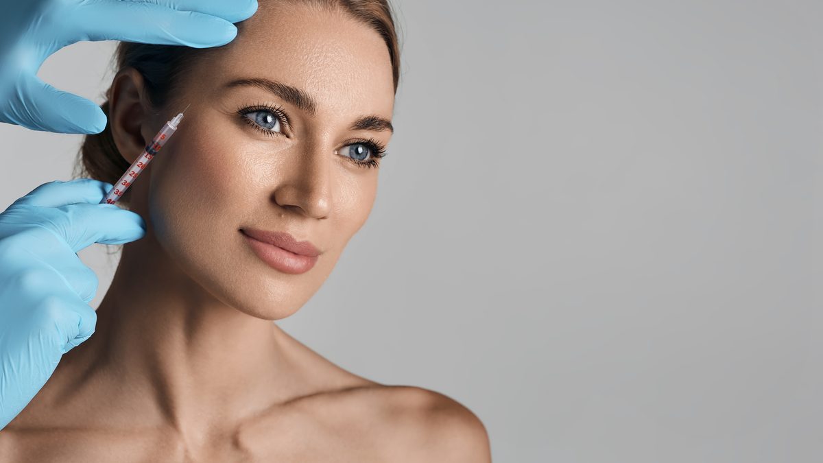 Woman with radiant glowing skin and serene expression — mesotherapy and skin booster results at Cosmo Clinic Lisbon